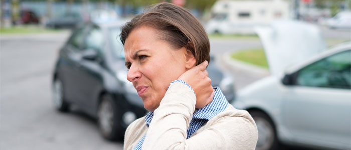 woman with a whiplash injury due to a car accident